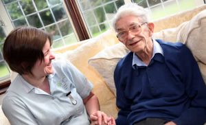 Carer with elderly man