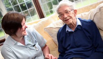 Carer with elderly man