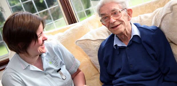 Carer with elderly man